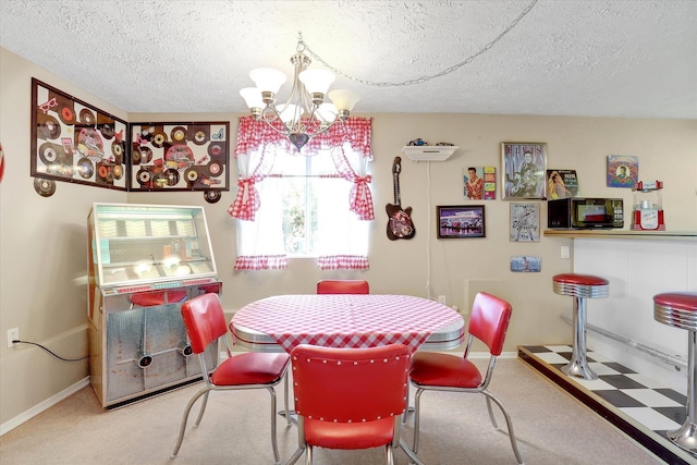3930 N Deer Lake Rd, Loon Lake, WA 99148 - dining room with a textured ceiling, a chandelier, and carpet flooring