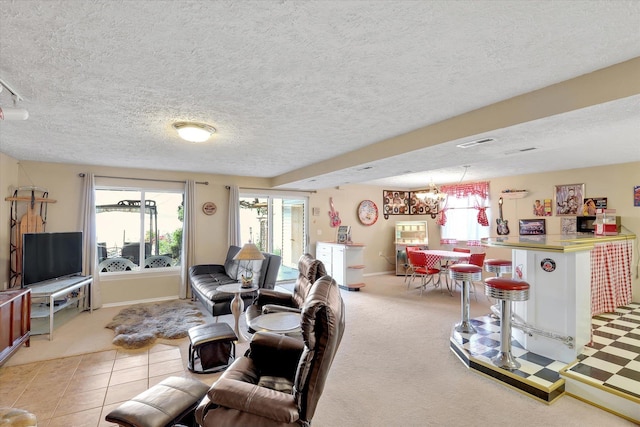 3930 N Deer Lake Rd, Loon Lake, WA 99148 - living room with a textured ceiling, a chandelier, and light colored carpet