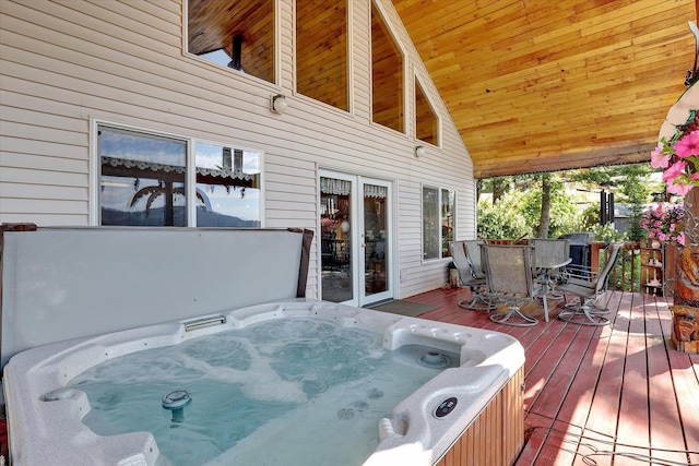 3930 N Deer Lake Rd, Loon Lake, WA 99148 - wooden deck with outdoor dining area and a hot tub