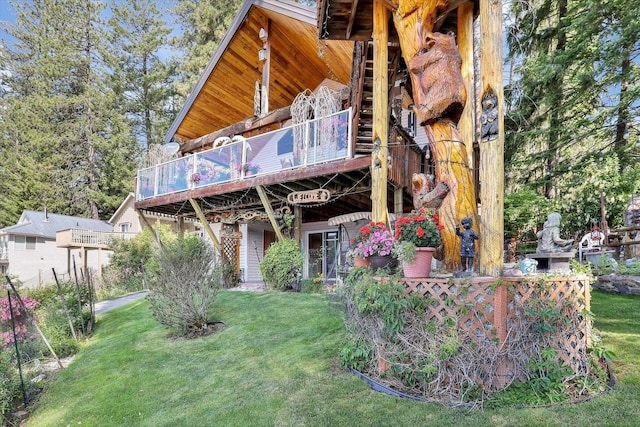 3930 N Deer Lake Rd, Loon Lake, WA 99148 - rear view of property with a yard and a deck