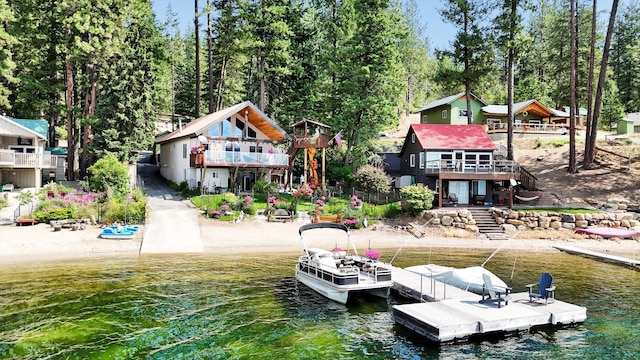 3930 N Deer Lake Rd, Loon Lake, WA 99148 - rear view of house with stairs and a deck with water view
