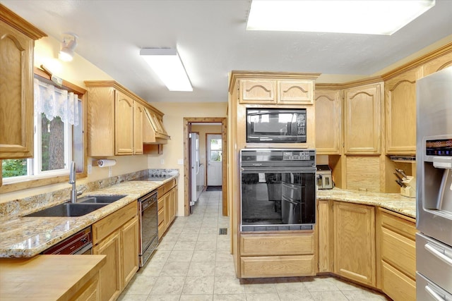 3930 N Deer Lake Rd, Loon Lake, WA 99148 - kitchen with black appliances, light brown cabinets, light stone countertops, and light tile patterned floors