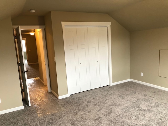 8516 N Summerhill Ln, Spokane, WA 99208 - unfurnished bedroom with lofted ceiling, dark carpet, and a closet