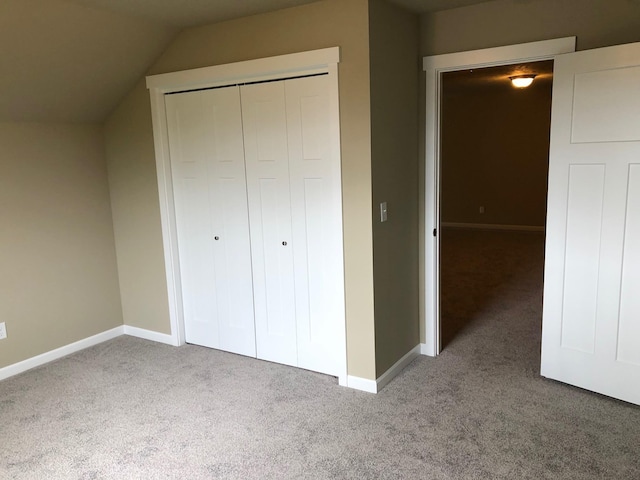 8516 N Summerhill Ln, Spokane, WA 99208 - unfurnished bedroom with carpet, a closet, and lofted ceiling