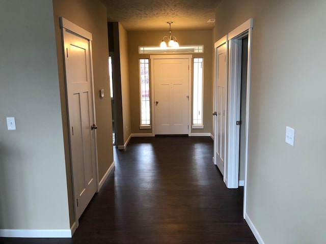 8516 N Summerhill Ln, Spokane, WA 99208 - foyer entrance featuring dark wood-type flooring and a chandelier