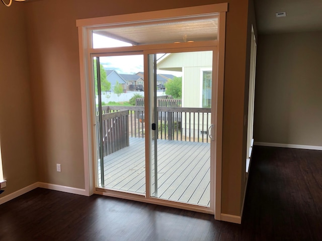 8516 N Summerhill Ln, Spokane, WA 99208 - doorway to outside featuring dark wood-style flooring and baseboards