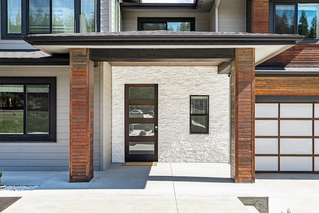 16215 W Coulee Hite Rd, Spokane, WA 99224 - doorway to property with stone siding and a porch
