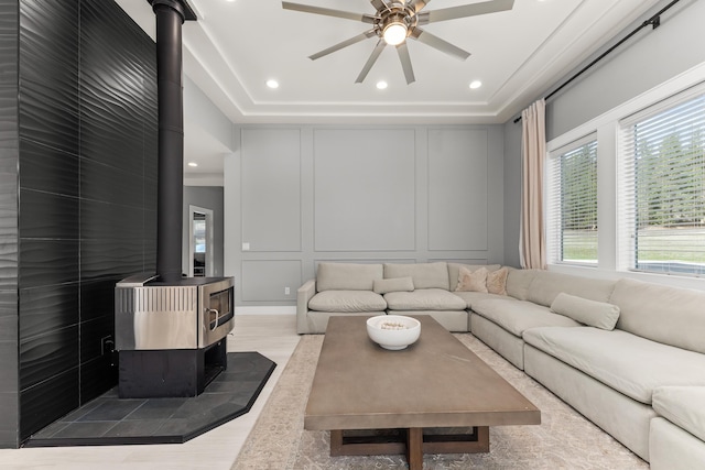 16215 W Coulee Hite Rd, Spokane, WA 99224 - living room with a wood stove, a decorative wall, ceiling fan, recessed lighting, and wood finished floors