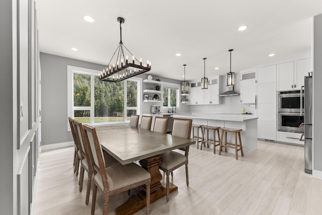 16215 W Coulee Hite Rd, Spokane, WA 99224 - dining space featuring recessed lighting, light wood-style flooring, and a chandelier