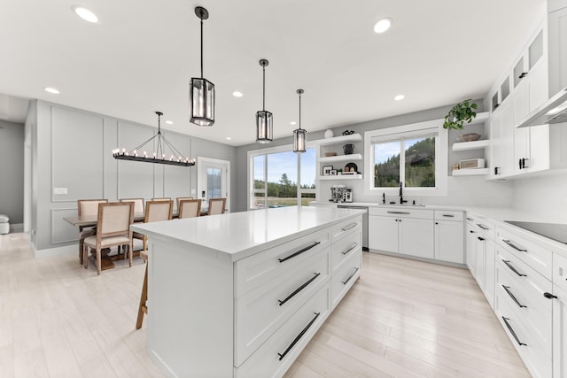 16215 W Coulee Hite Rd, Spokane, WA 99224 - kitchen with open shelves, stainless steel dishwasher, recessed lighting, a kitchen island, and black electric stovetop