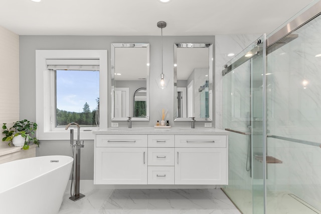 16215 W Coulee Hite Rd, Spokane, WA 99224 - bathroom with double vanity, a marble finish shower, a freestanding tub, marble look tile flooring, and recessed lighting