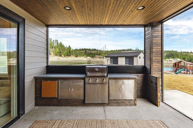 16215 W Coulee Hite Rd, Spokane, WA 99224 - view of patio / terrace with an outdoor kitchen and a playground