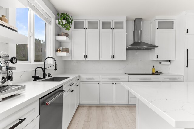 16215 W Coulee Hite Rd, Spokane, WA 99224 - kitchen featuring stainless steel dishwasher, wall chimney exhaust hood, open shelves, white cabinets, and light wood-style flooring