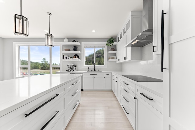 16215 W Coulee Hite Rd, Spokane, WA 99224 - kitchen featuring wall chimney exhaust hood, open shelves, black electric stovetop, dishwasher, and decorative light fixtures