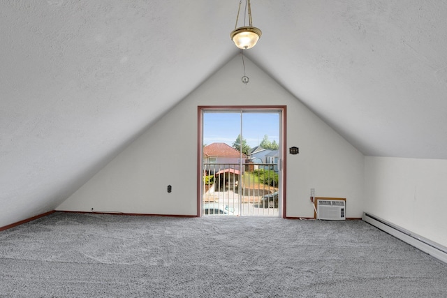 1407 E Broad Ave, Spokane, WA 99207 - additional living space with baseboard heating, lofted ceiling, carpet flooring, a textured ceiling, and a wall unit AC
