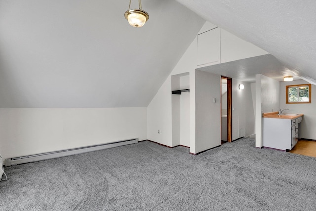 1407 E Broad Ave, Spokane, WA 99207 - bonus room with a baseboard heating unit, light carpet, and lofted ceiling