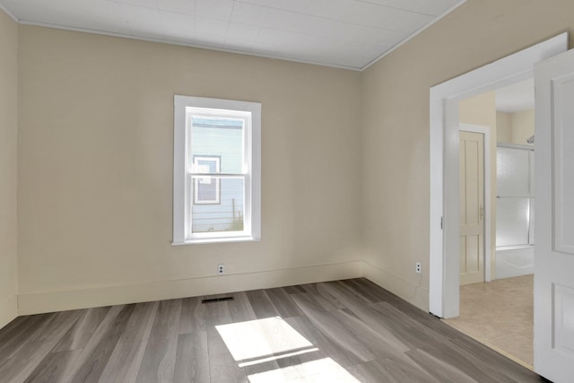1407 E Broad Ave, Spokane, WA 99207 - empty room with wood finished floors and crown molding