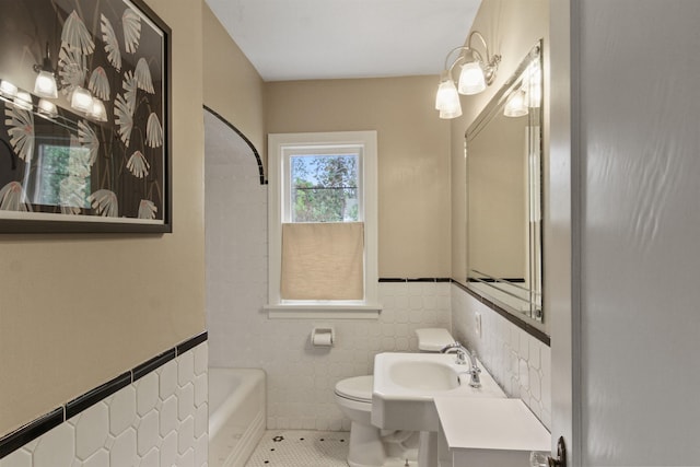 1103 W 20th Ave, Spokane, WA 99203 - full bathroom with tile walls, tile patterned floors, wainscoting, and shower / washtub combination
