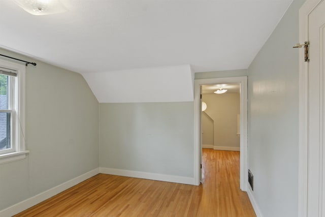 1103 W 20th Ave, Spokane, WA 99203 - additional living space featuring light wood-style flooring and vaulted ceiling