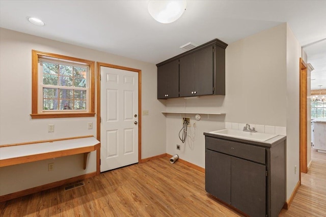 5245A W Prufer Crosscut Rd, Deer Park, WA 99006 - laundry area with cabinet space, hookup for a washing machine, light wood finished floors, hookup for an electric dryer, and recessed lighting