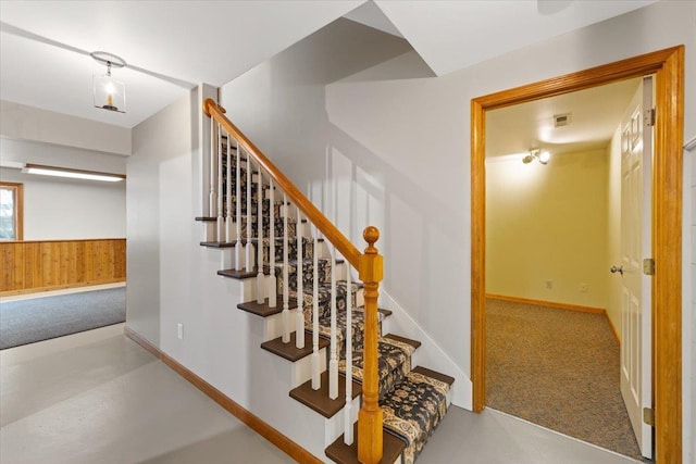 5245A W Prufer Crosscut Rd, Deer Park, WA 99006 - staircase with carpet, wood walls, and a wainscoted wall