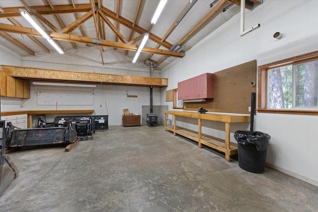 5245A W Prufer Crosscut Rd, Deer Park, WA 99006 - garage featuring a workshop area and a wood stove