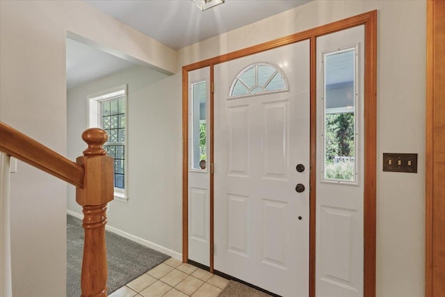 5245A W Prufer Crosscut Rd, Deer Park, WA 99006 - entryway featuring light tile patterned floors, light carpet, and stairs
