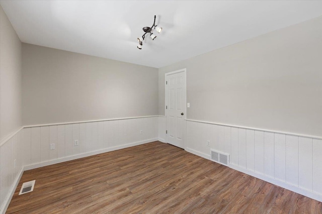 5245A W Prufer Crosscut Rd, Deer Park, WA 99006 - spare room featuring wood finished floors and a wainscoted wall