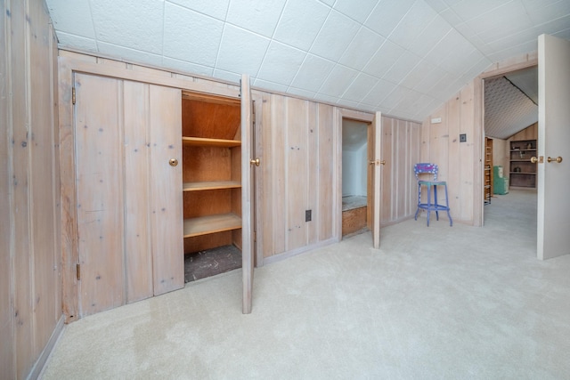 5224 N Post St, Spokane, WA 99204 - unfurnished bedroom featuring wooden walls, lofted ceiling, and carpet