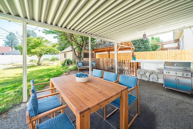 5224 N Post St, Spokane, WA 99204 - fenced backyard with a grill, a patio, and outdoor dining area