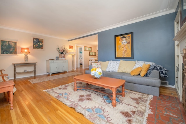5224 N Post St, Spokane, WA 99204 - living room featuring ornamental molding, a fireplace, and wood finished floors