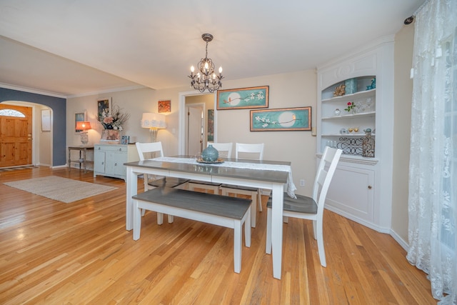 5224 N Post St, Spokane, WA 99204 - dining area with a chandelier, arched walkways, light wood-style floors, and built in features