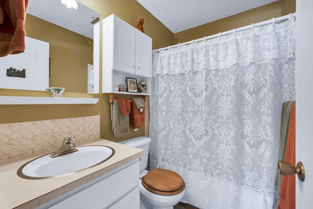 1401 W 1st St, Newport, WA 99156 - bathroom with vanity, a textured ceiling, backsplash, and a shower with shower curtain