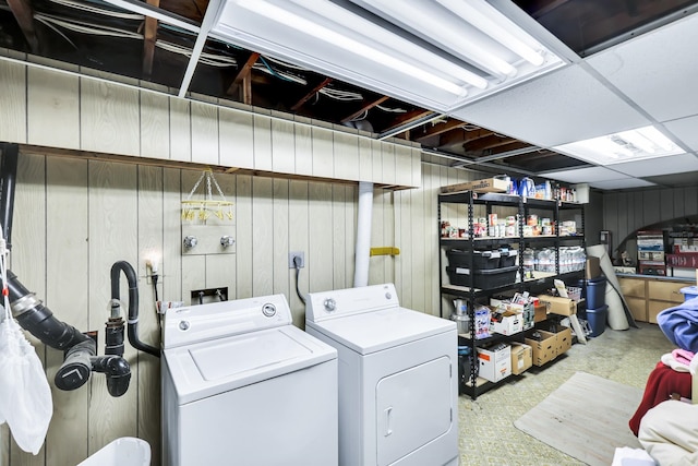 1401 W 1st St, Newport, WA 99156 - laundry room featuring washer and clothes dryer and wooden walls