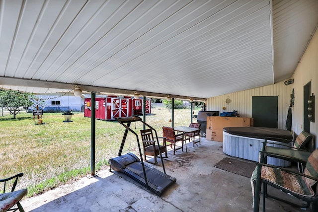 1401 W 1st St, Newport, WA 99156 - view of patio / terrace featuring a hot tub and an outdoor structure