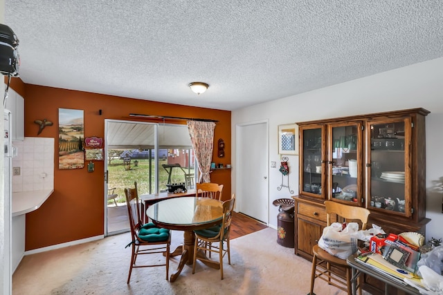 1401 W 1st St, Newport, WA 99156 - dining space featuring a textured ceiling and baseboards