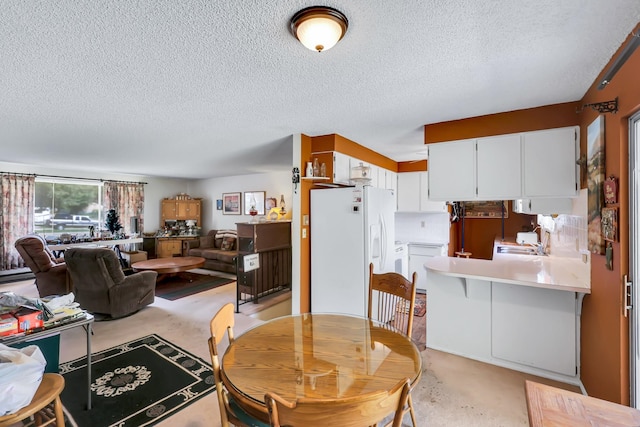 1401 W 1st St, Newport, WA 99156 - dining area featuring a textured ceiling