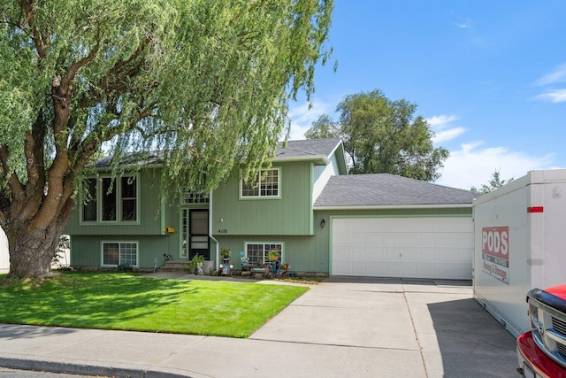 4110 E Ermina Ave, Spokane, WA 99217 - view of front of home featuring a garage, concrete driveway, a front lawn, and a shingled roof