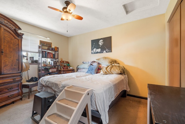 4110 E Ermina Ave, Spokane, WA 99217 - bedroom with light colored carpet, a textured ceiling, a closet, attic access, and ceiling fan