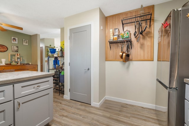 4110 E Ermina Ave, Spokane, WA 99217 - kitchen featuring freestanding refrigerator, ceiling fan, light wood-style flooring, and light countertops