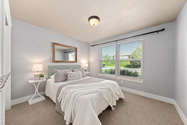 7014 E Columbia Dr, Spokane, WA 99217 - bedroom with baseboards and light carpet