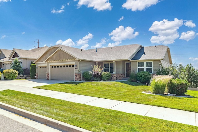7014 E Columbia Dr, Spokane, WA 99217 - ranch-style house with a garage, a front yard, concrete driveway, stone siding, and a shingled roof