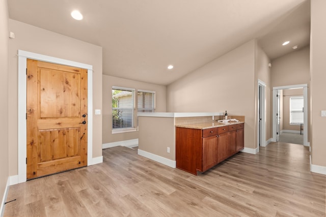 7014 E Columbia Dr, Spokane, WA 99217 - bar area with light wood-style floors, vaulted ceiling, and recessed lighting