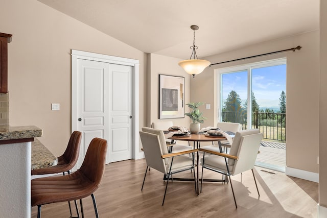 7014 E Columbia Dr, Spokane, WA 99217 - dining space with light wood finished floors and vaulted ceiling