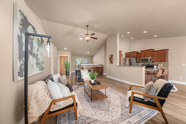 7014 E Columbia Dr, Spokane, WA 99217 - living room featuring light wood finished floors, vaulted ceiling, ceiling fan, and recessed lighting