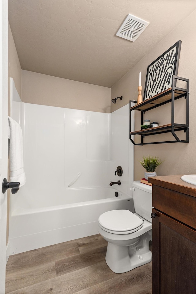 7014 E Columbia Dr, Spokane, WA 99217 - full bathroom with wood finished floors, shower / bath combination, and vanity