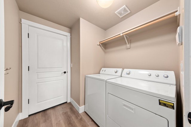 7014 E Columbia Dr, Spokane, WA 99217 - laundry room with separate washer and dryer and light wood-type flooring