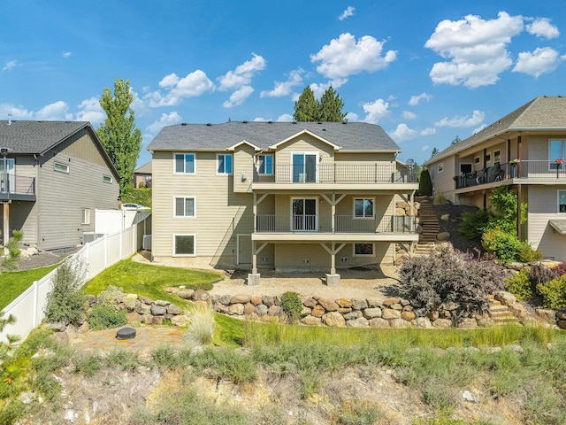 7014 E Columbia Dr, Spokane, WA 99217 - back of house featuring a balcony, a fenced backyard, a residential view, and stairs