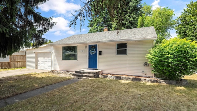 6121 N Belt St, Spokane, WA 99205 - view of front of house featuring driveway, a garage, a chimney, and roof with shingles