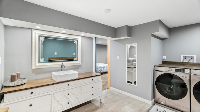 6121 N Belt St, Spokane, WA 99205 - laundry room with independent washer and dryer and light wood finished floors